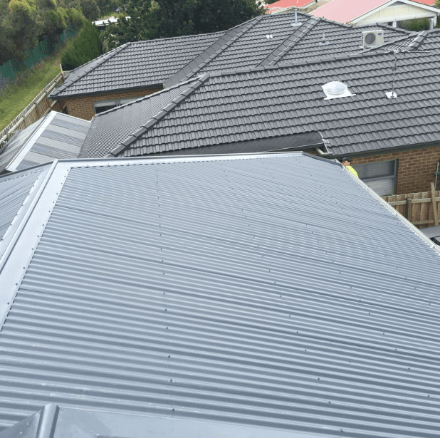 How Far Should Metal Roof Overhang Gutters? Expert Guide